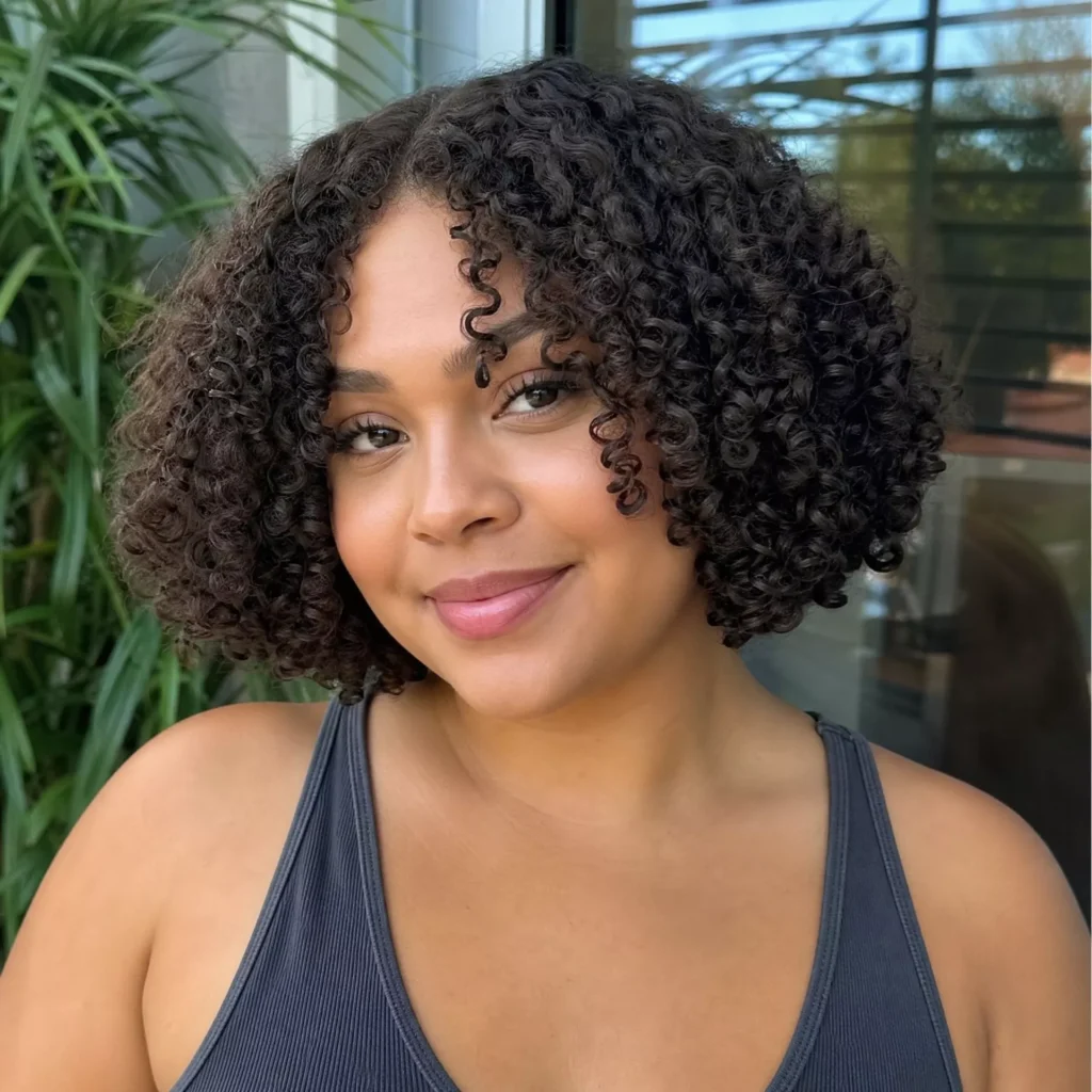 25 Curly Bob Hairstyles for Round Faces That Really Work 5 Defined Curl Bob